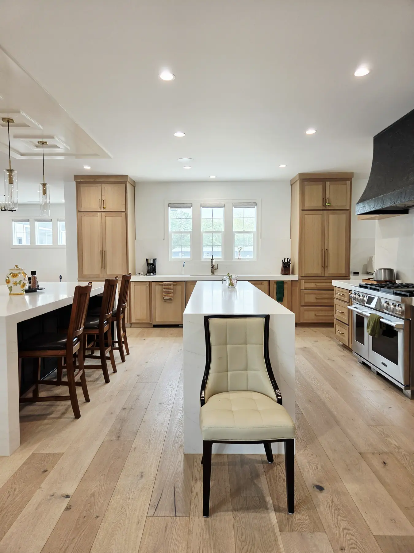 Freshly cleaned kitchen with bright counters and wood cabinetry